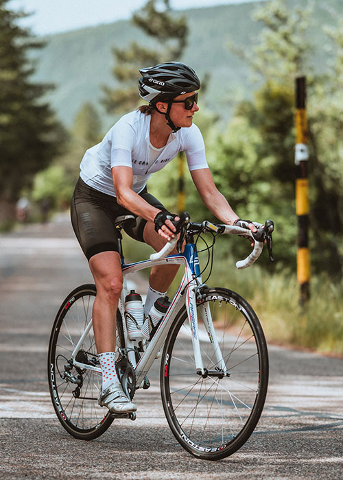 Lady wearing Swiss made ILEVE DISTRICT cycling glasses rides her road bike from Sault towards Mont Ventoux
